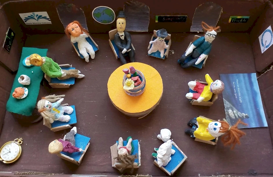 photo showing a diarama model of Horsham meeting room with clay figures.